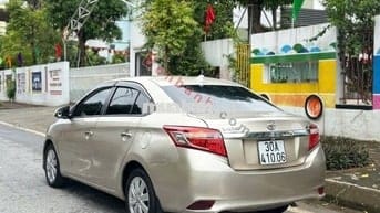 Toyota Vios 2014 1.5E - màu vàng đồng