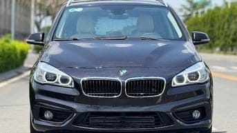 Bán BMW 218i sản xuất cuối 2015 lăn bánh 01.2016 , màu nâu nho đậm 
