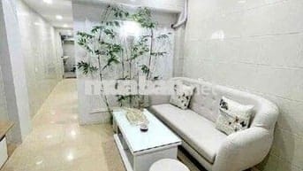 Tập thể 50 m2 sổ đỏ tầng 1 mặt ngõ thông phố Bùi ngọc Dương 5 m ra oto