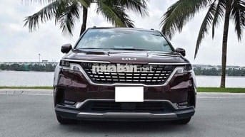 Kia Carnival 2.2D Signature 2023 màu đỏ mận