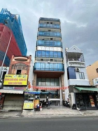 Toà nhà mt 7c Phổ Quang Q.Tân Bình, DT: NH 10x20m, XD hầm 6T hđt 200tr