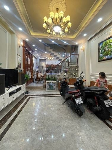 nhà đường số tân quy,4 tầng,nhà như hình giá 9ty9.Lh atrung 0931432374
