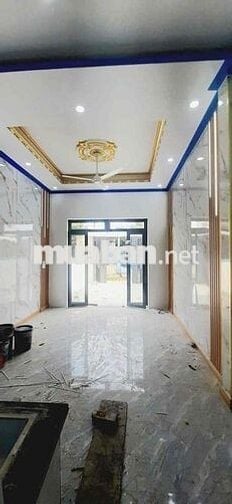 Căn nhà lầu trệt đồng sở hữu sân ô tô tại chợ Tân Phước khánh BD (củ)