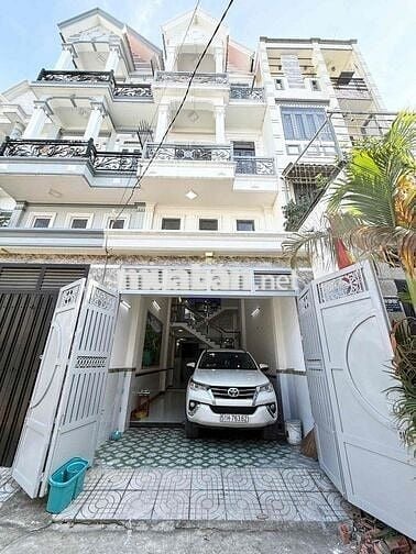 Nhà 3 lầu Lâm Thị Hố Q12 ngay trường học Việt Âu. Có garage xe.