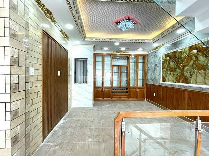Nhà 1 trệt 1 lửng 2 lầu DTSD200M2 85 đường Bình Thành Quận Bình Tân