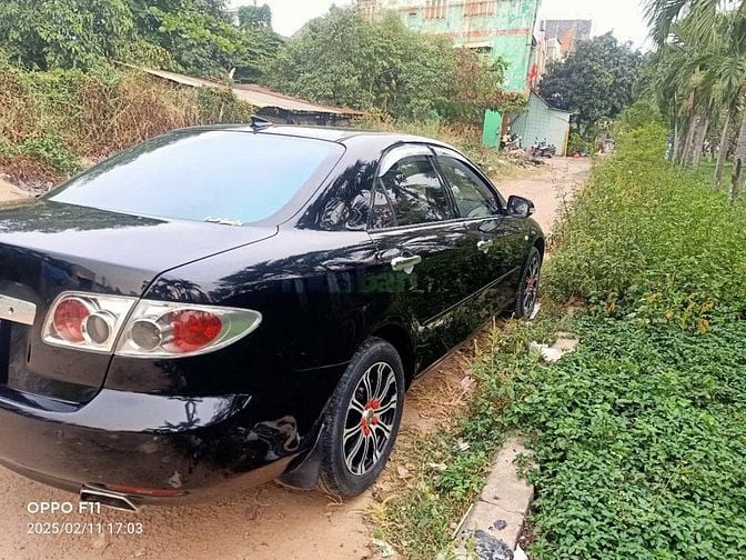 Cần bán mazda 6 AT màu đen. sx 2005