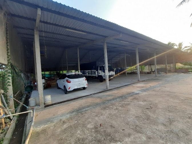 Thuê Kho Xưởng mặt tiền QL1A, dt ~2000m2 có bãi xe, Trạm điện 3 pha