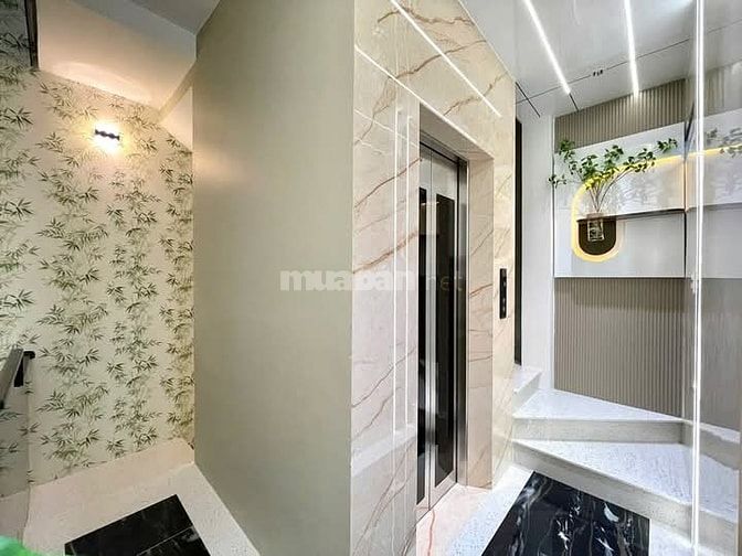 Nhà 4 x 11 đúc 1 lững 4 lầu có thang máy quang trung p11 gò vấp 