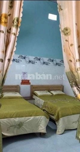 Bán nhà ở gồm cả nhà nghỉ có hồ cá Koi tại Đường Nguyễn Tất Thành, Thị