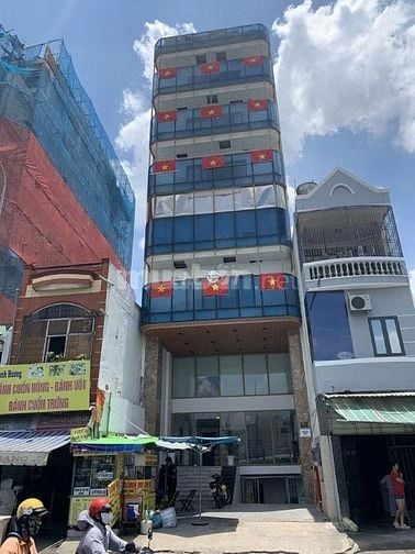 Toà nhà mt 7c Phổ Quang Q.Tân Bình, DT: NH 10x20m, XD hầm 6T hđt 200tr