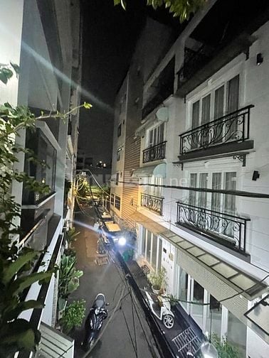 nhà đường số tân quy,4 tầng,nhà như hình giá 9ty9.Lh atrung 0931432374