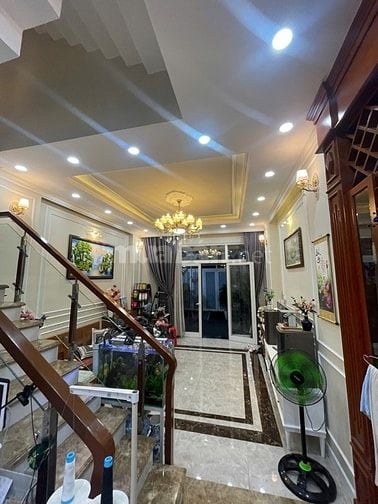 nhà đường số tân quy,4 tầng,nhà như hình giá 9ty9.Lh atrung 0931432374