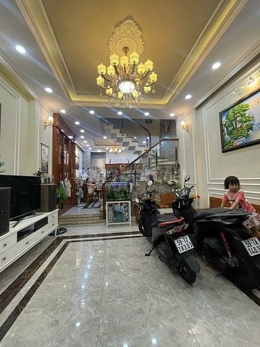 nhà đường số tân quy,4 tầng,nhà như hình giá 9ty9.Lh atrung 0931432374