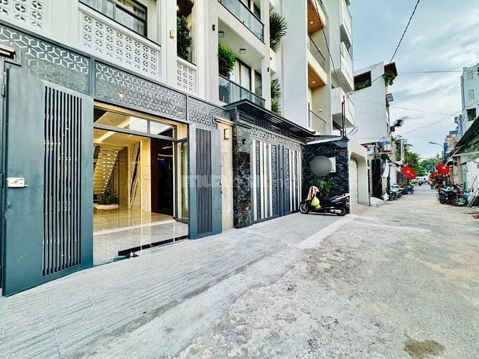 NÉT CĂNG!!! Tuyệt phẩm 5 Lầu THANG MÁY gara đậu 2 xe hơi Quang Trung
