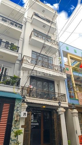 Nhà 6 tầng thang máy (4,5x18m). 13 phòng. HDT 60tr/tháng. Sát mặt tiền