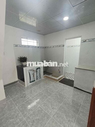 NHÀ 550TR NGAY MẶT TIỀN ĐƯỜNG 824 KẾ CẦU LỚN HÓC MÔN 40m2 sử dụng