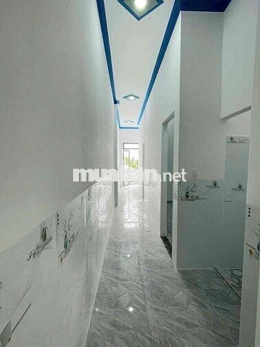 Căn nhà lầu trệt đồng sở hữu sân ô tô tại chợ Tân Phước khánh BD (củ)