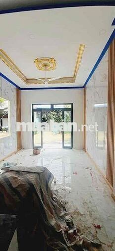 Căn nhà lầu trệt đồng sở hữu sân ô tô tại chợ Tân Phước khánh BD (củ)