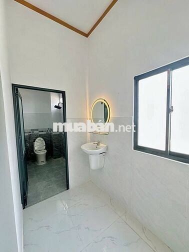 BÁN NHÀ TRỆT LẦU 90M2 GẦN KDL BỬU LONG