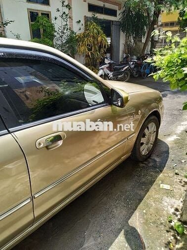 Đổi xe cần bán ford laser 2004 GHIA 1.8 AT.