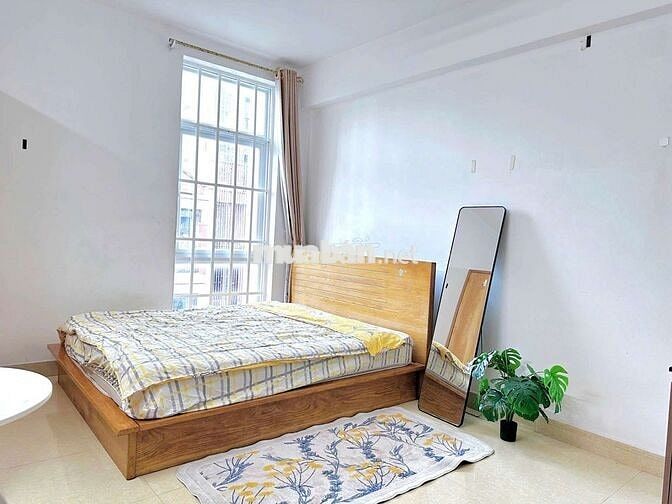 Cho thuê Phòng 30m2 full nội thất ban công đường Phan Chu Trinh gần Q1