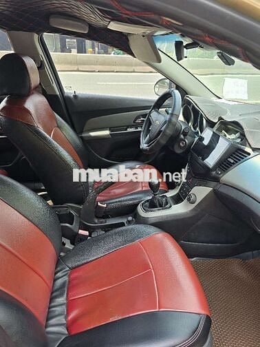 Ô tô Chevrolet Cruze 2011 số sàn màu vàng cát