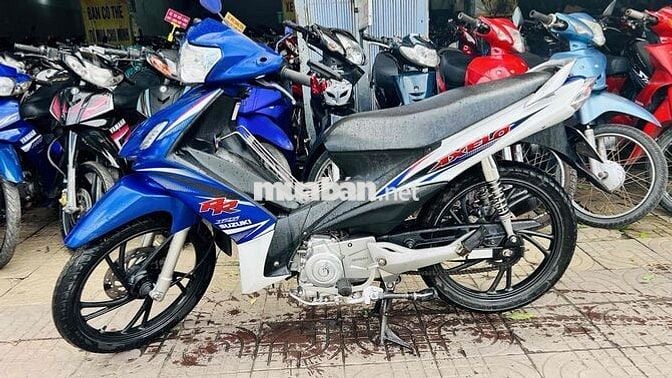 xe axelo suzuki trắng xanh gp