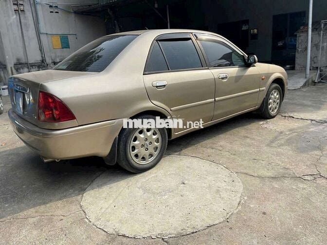 Ford Laser Vàng cát Số sàn