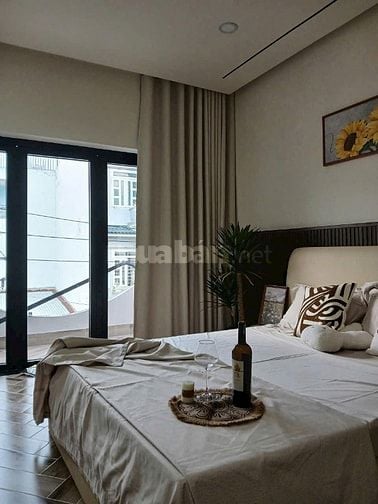 Nhà dt108m2 đúc 5 tầng 8pn thang máy hẻm 12m Lê Văn Quới,Q.Bình Tân