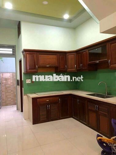 NHÀ  XÂY KIÊN CỐ 4 LẦU 1 XẸC ĐƯỜNG LÊ VĂN KHƯƠNG PHƯỜNG HIỆP THÀNH.Q12