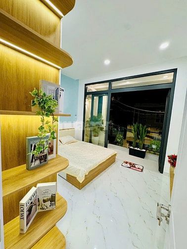 Bán nhà Dt 4m Nở Hậu 5m X 13m Đường xe hơi. Xe tải thông. CÓ PN dưới 