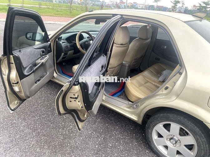 Ford Laser Vàng cát Số sàn