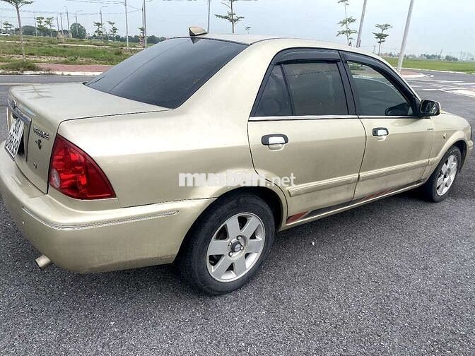 Ford Laser Vàng cát Số sàn