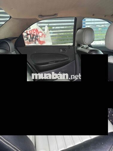 Mazda 323 2000 Đen