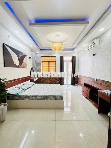 Cho thuê nhà hẻm xe hơi thông cách mt quang trung 50m