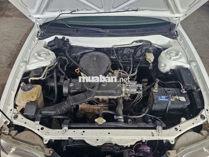 TOYOTA COROLLA 1.3 SỐ SÀN TRẮNG 5 CHỖ