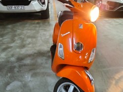 Gia đình bán xe Vespa LX 125ie màu cam mới 85%