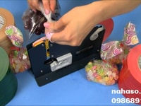 Máy buộc đầu, cắt, dán băng keo trang trí túi Máy buộc đầu, cắt, dán băng keo trang trí túi