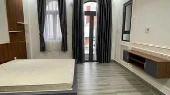 Nhà xây 4 tầng - sân để 2 ô tô - đường Lê Quang Định P 7 Bình Thạnh