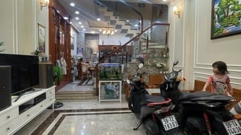 nhà đường số tân quy,4 tầng,nhà như hình giá 9ty9.Lh atrung 0931432374
