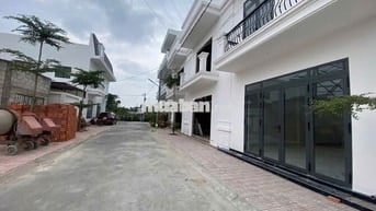 Bán nhà 1 trệt 1 lầu 100m tại Trung tâm thị trấn Tân Hiệp, Quốc lộ 1A.