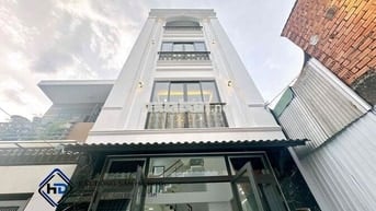 Nhà trệt lửng 3 lầu 5x14 mới 100% có gara xe hơi