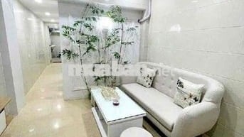Tập thể 50 m2 sổ đỏ tầng 1 mặt ngõ thông phố Bùi ngọc Dương 5 m ra oto