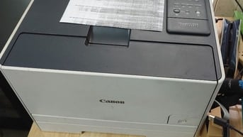 Xác máy in màu laser Canon 7100Cn hư hộp mực
