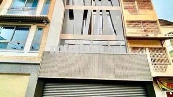 NHÀ CHO THUÊ ĐƯỜNG HUỲNH VĂN BÁNH_ TRỆT 4 LẦU_ THANG MÁY, ỐP KÍNH ĐẸP.