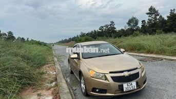 Ô tô Chevrolet Cruze 2011 số sàn màu vàng cát