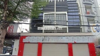 Nhà mặt tiền .Quận Bình Tân .Dt.12x21.5m. KC. 1 hầm 5 lầu . thang máy