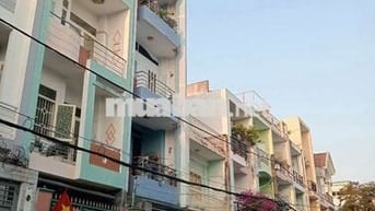 nhà 4 tầng đối diện công viên KDC ấp 5 phong phú DT 4.5m x 18m 4 tầng 