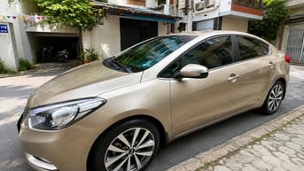 Chính chủ Cần bán xe kia k3 AT 1.6 màu vàng cát biển Hà Nội